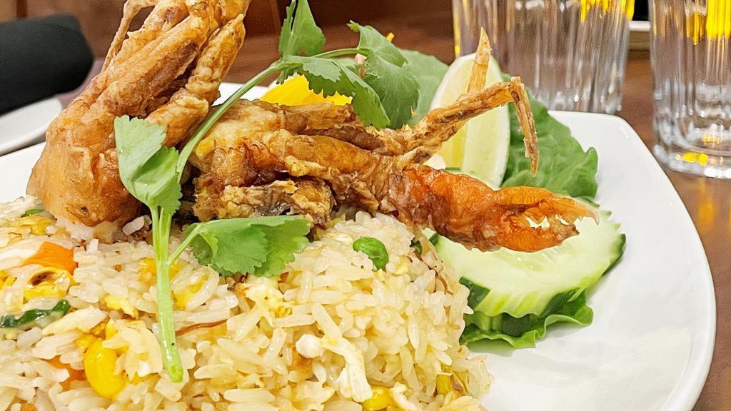Buster Crab Fried Rice  · Buster Crab referred to a soft-shell that had yet to complete molting.  Jasmine rice stir fried with seafood sauce, egg, peas, carrots, onion with a generous portion of soft shell crab meat.