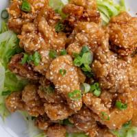 Crispy Garlic Chicken · Our house specialty, deep fried chicken with house garlic sauce and topped with sesame seeds...