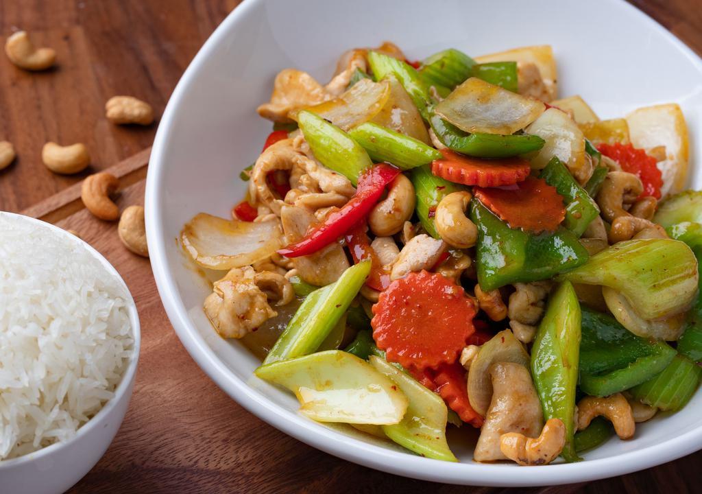 Golden Cashew Nut · Stir fried with red and green bell peppers, celery, carrots, onions with cashew nuts sauce.
