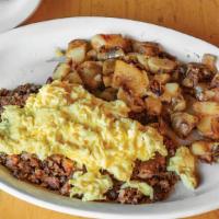Corned Beef Hash Skillet · A layer of home fries, a layer of corned beef hash, and a layer of Cheddar cheese topped wit...