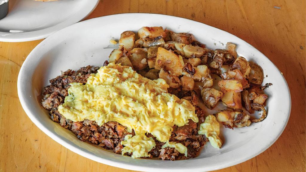 Corned Beef Hash Skillet · A layer of home fries, a layer of corned beef hash, and a layer of Cheddar cheese topped with two eggs any style. Includes authentic N.Y. Bagel with cream cheese or toast