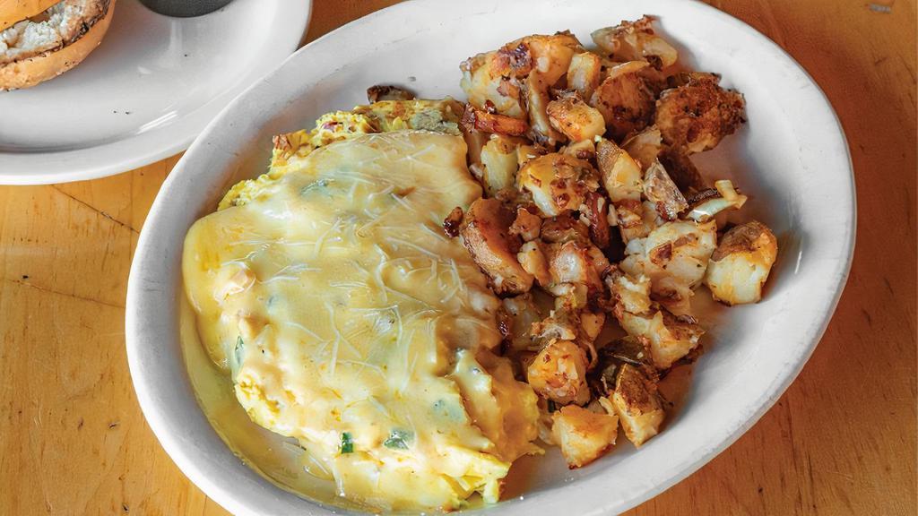 French Omelet · Bacon, mushrooms, scallions, sautéed onion, and Parmesan and Havarti cheese. Served with choice of home fries, fresh fruit salad, or hash browns. Includes authentic N.Y. Bagel with cream cheese or toast