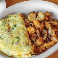 Western Corned Beef Omelet · Corned Beef, green peppers, and onion. Served with choice of home fries, fresh fruit salad, ...