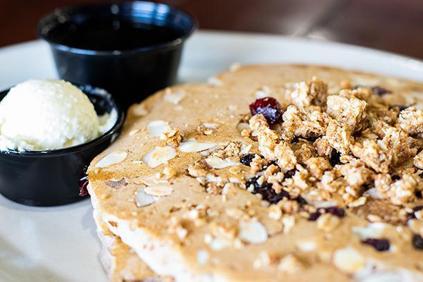 Protein Pancakes · 100% whole wheat pancake batter with granola, blueberries, and sliced almonds