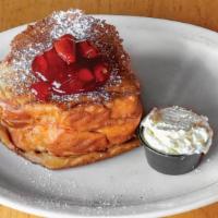 Yummy Stuffed French Toast · Batter-dipped Challah stuffed with strawberry jam and cream cheese, fried crisp, and dusted ...