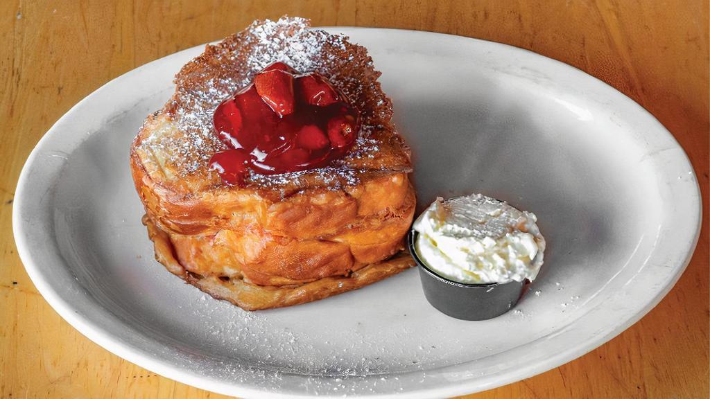 Yummy Stuffed French Toast · Batter-dipped Challah stuffed with strawberry jam and cream cheese, fried crisp, and dusted with powdered sugar. Served with side of fresh fruit salad