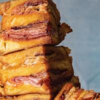 Mark'S Monte Cristo · Oven-roasted turkey, Boar’s Head ham, bacon, and Swiss cheese. Dipped in batter, fried crisp...