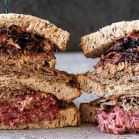 Becker'S Brooklyner · Hot pastrami, corned beef, and braised brisket on double-baked Jewish Rye. Served with your ...