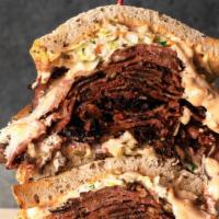 Times Square Ny | Corned Beef · Corned Beef smothered with coleslaw and 1000 Island dressing on double baked Jewish Rye.  Se...