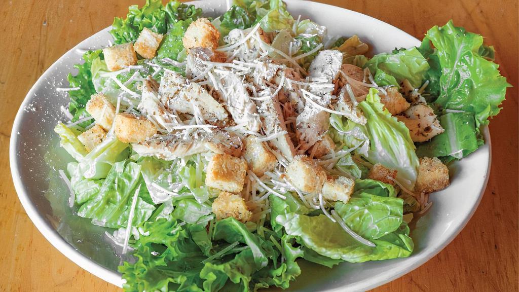 Christy'S Chicken Caesar Salad · Sliced chicken breast, crisp Romaine lettuce, Parmesan cheese, and seasoned croutons mixed with Caesar dressing