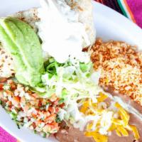 Burrito Dinner Plate · Your choice of burrito topped with cream and guacamole with a side of beans, rice, lettuce, ...