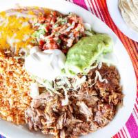 Dinner Plate · Your choice of meat served on a plate with Mexican rice, beans, sour cream, lettuce, guacamo...