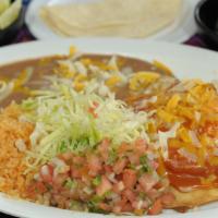 Huevos Rancheros · Two over easy eggs over fried tortillas, served with beans, rice, cheese and pico de gallo. ...