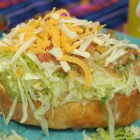 Chimichanga · A burrito deep fried in your choice of burrito topped with lettuce, sour cream and Ole's gua...