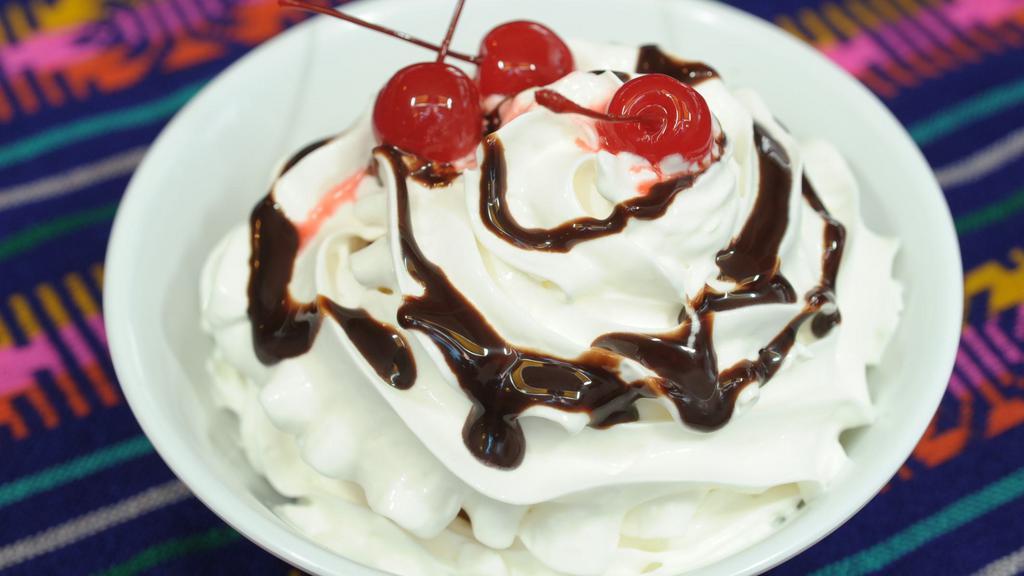 Fried Ice Cream · Breaded ice cream that is quickly deep-fried. Served with whip cream, chocolate sauce, and a cherry on top