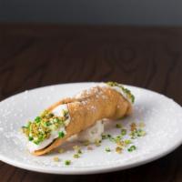 Cannoli · Fried pastry dough filled with sweet, creamy ricotta filling, dusted with pistachio crumbs a...