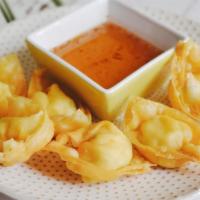 Crab Cheese Wonton · Crispy homemade wonton wrapped with cream cheese and imitation crab.  Served with homemade s...