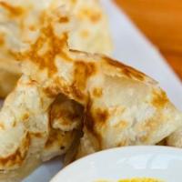 Roti Canai / 印度薄饼 · Malaysian all time favorite, crispy style pancake with curry dipping sauce.