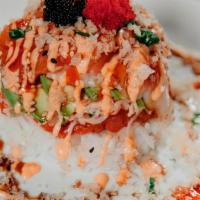 Sushi Tower · Salmon and escolar layered over a bed of rice, surimi, avocado, and spicy tuna; topped with ...