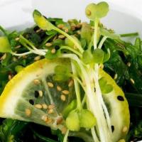 Seaweed Salad · Thin marinated slices of wakame seaweed mixed with sesame seeds.