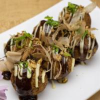 Takoyaki · 6 pieces of fried octopus balls. Come with Japanese mayo, crispy fried onion, bonito flakes,...