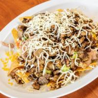 Super Nachos · Your choice of meat with rice beans guacamole cheese on top of nacho chips