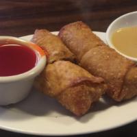 2 Egg Rolls · Crispy roll filled with minced chicken, shredded cabbage, carrots and celery. Served with sw...