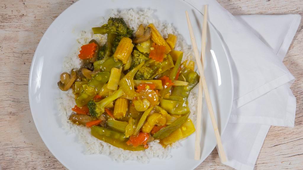 Curry Vegetables · Napa cabbage, broccoli, carrots, bamboo shoots, water chestnuts, mushrooms, baby corn and snow peas stir fried in a spicy curry sauce. Served with steamed rice. Hot and spicy.