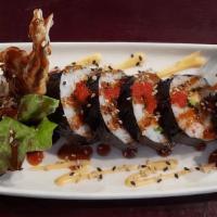 Spider Roll · Soft shell crab, cucumber, avocado, smelt eggs inside with eel sauce on top.