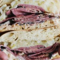 Reuben Platforms · Pastrami, house made sauerkraut, havarti, pickled mustard dijonnaise, on ciabatta.