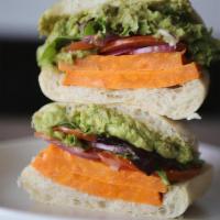 Veggie Sandwich Platforms · Roasted sweet potato, avocado mash, sliced tomato, red onions, dressed greens, on ciabatta.