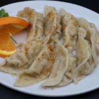Steamed Dumplings (8) (Delivery) · Steamed dumplings stuffed with ground pork and vegetables . Served with our homemade special...