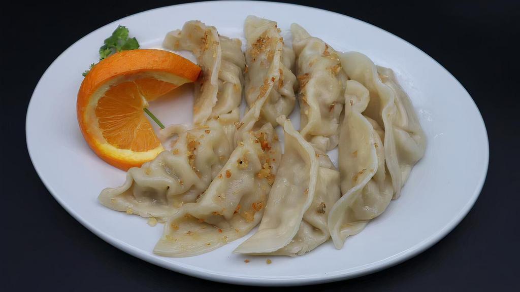 Steamed Dumplings (8) (Delivery) · Steamed dumplings stuffed with ground pork and vegetables . Served with our homemade special ginger soy sauce.