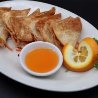 Fried Wontons (8) (Delivery) · Deep-fried marinated ground pork wrapped in wonton paper. Served with sweet and sour sauce.