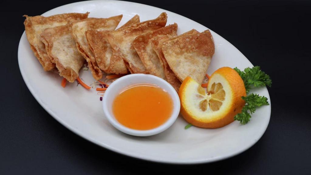 Fried Wontons (8) (Delivery) · Deep-fried marinated ground pork wrapped in wonton paper. Served with sweet and sour sauce.