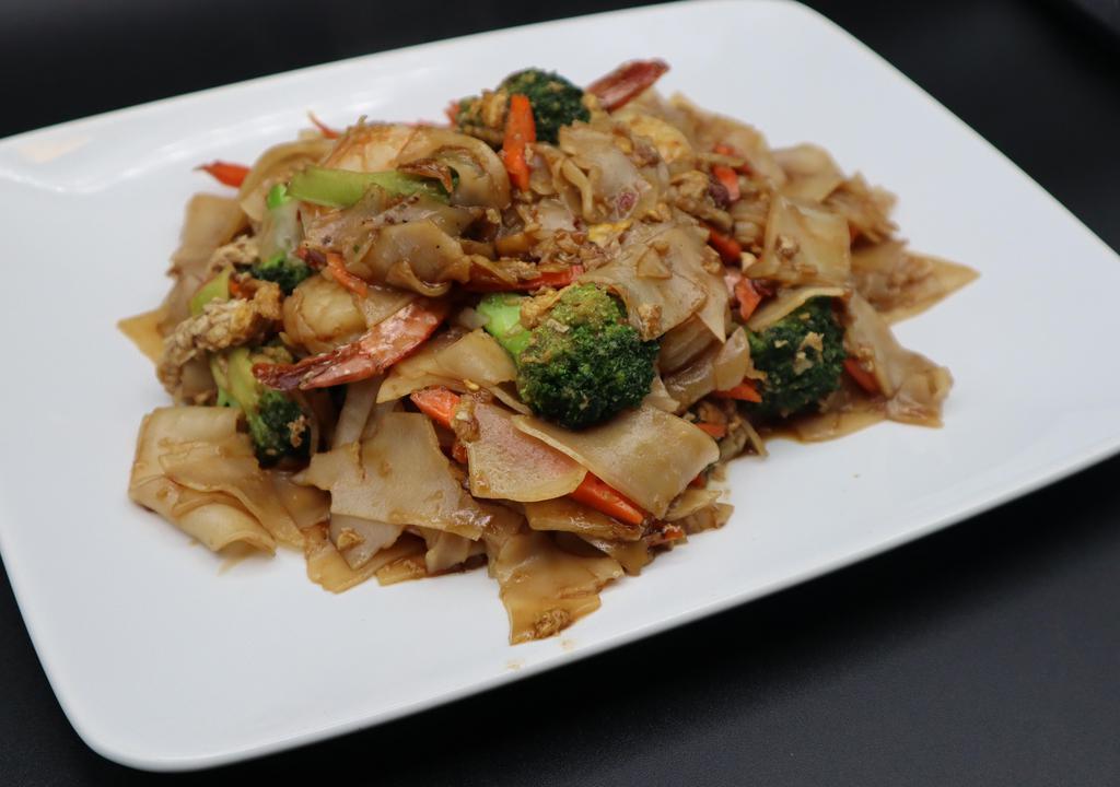 Pad See-Ew (Delivery) · Stir-fried wide rice noodles with egg, broccoli, carrots and your choice of meat in our delicious sweet black soy sauce.