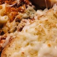 House Mac And Cheese · Sweet cream and a blend of specialty cheeses, topped with a breadcrumb crust.