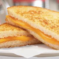 Grilled Cheese Sandwich · Our grown-up version of the grilled cheese with four slices of cheese on a sourdough bread.