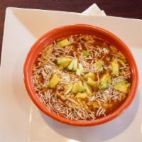 House Tortilla Soup · Tortilla soup cooked with vegetables and chicken. Topped with fresh avocado, jack cheese and...
