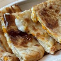 Naan Quesadilla · Fresh mozzarella and hand-roll naan bread with choice of protein.   Served with Tikka Dippin...