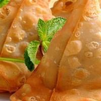 Samosa (2Ct.) · Crispy pastries stuffed with potatoes, peas, and secret spices. Served with a house chutney.