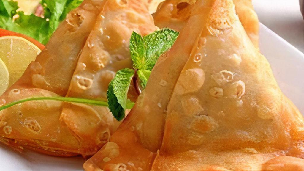 Samosa (2Ct.) · Crispy pastries stuffed with potatoes, peas, and secret spices. Served with a house chutney.