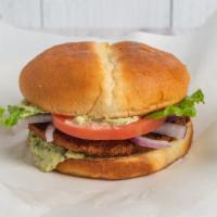 Chickpeas Vegan Burger · Chickpeas patty with parsley, onions, tahini sauce, lettuce, tomatoes, cucumbers.