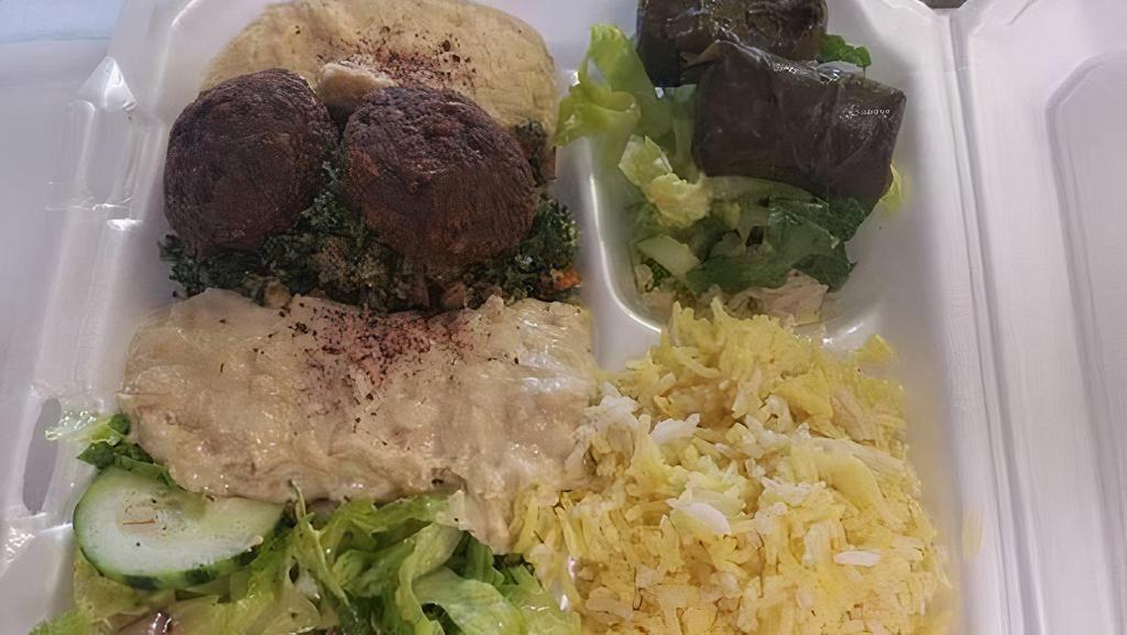 Vegetarian Plate · Falafel, hummus, baba ganoush, tabbouleh salad & grape leaves.