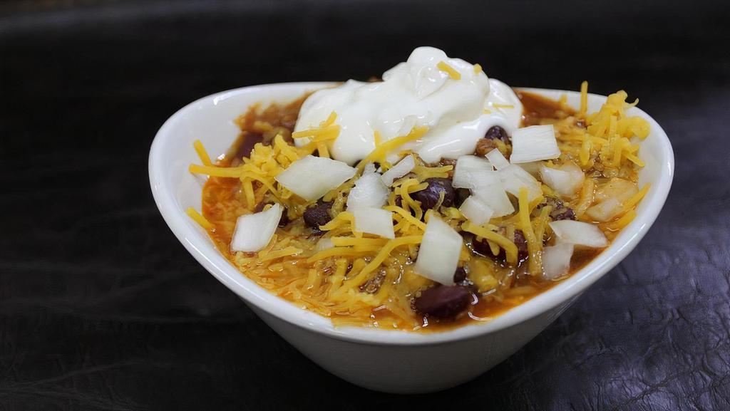Chili · Our rich and meaty red bean chili served with onions, cheddar cheese, sour cream, and cornbread.