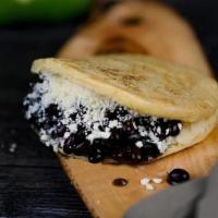 Arepa Domino · Black beans, cotija cheese, Guasacaca sauce and love.