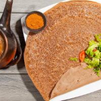 Shiro · Grounded peas cooked with exotic spices and served with injera.