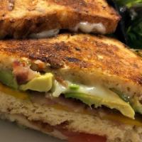 Double Decker Grilled Cheese · Carrot sunflower bread, three cheeses, bacon, avocado, tomato.