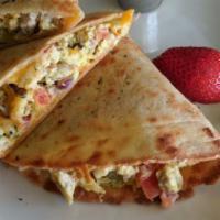Breakfast Quesadilla With Fresh Salsa · Eggs, sausage, cheese, onion, green chiles, tomatoes, housemade tortilla.  House Potatoes