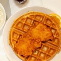 Waffle With Chicken · Two hand breaded chicken tenders on a fluffy waffle.